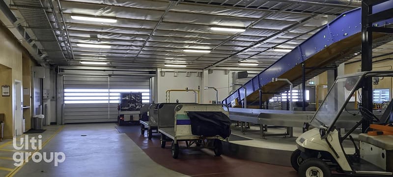 Ulti Spiral Door installed in an airport baggage handling area.